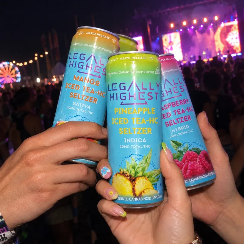 Three cans raised together at a night festival