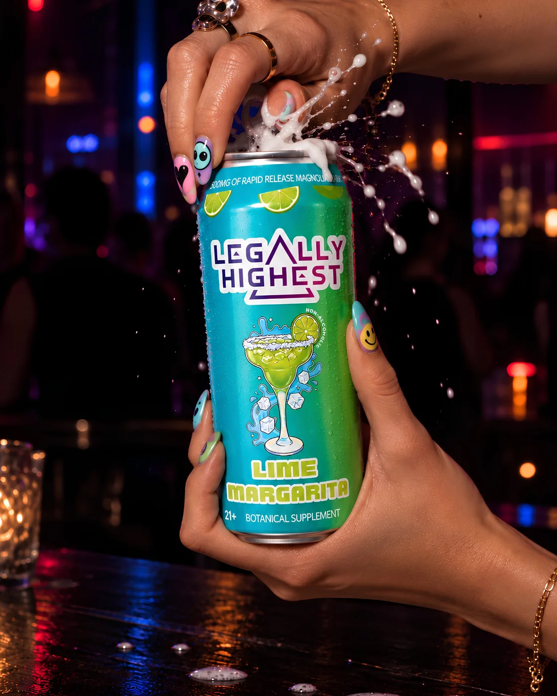 Hands cracking open a Lime Margarita can at a bar, spray frozen mid-air